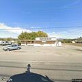 Pickup hits building and driver reports head pain