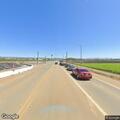 Driver swerving in white pickup on Highway 25