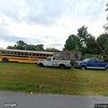 Suspicious male reported at home in red Ford sedan