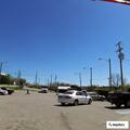 Officer assists driver with stalled car at gas station