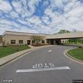 Person lying in facility driveway in Bowling Green