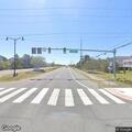 Person having severe allergic reaction at road intersection