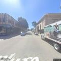 Man yelling and hitting signs on East Main Street