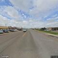 Person slumped over bicycle at TX-107 and Industrial St