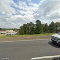 Stalled 18-wheeler blocking outside lane