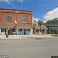 Two vehicles stopped in intersection on Main Street