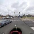 Traffic stop involving silver Nissan at intersection
