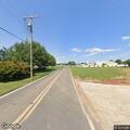 Male in 30s walking in roadway with flashlight in New Windsor