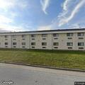 Person experiencing leg pain at American Inn