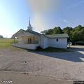 Person yelling near church wooded area