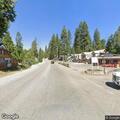 Vehicle backs into building near Shaver Lake