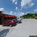 Driver unresponsive after car hits pole at store