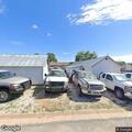 Officer locates suspected black pickup at auto shop