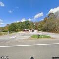 Vehicle disabled after hitting rock in roadway