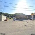 Man with stick threatens passerby near dumpster