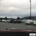 SUV hits pole and ends up on sign at Walmart lot