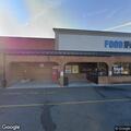 Officer checks suspicious vehicle at store lot