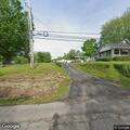 Officer checks on man in yard on South Main Street
