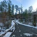 Large boulder blocking roadway on Hill Chestnut Road