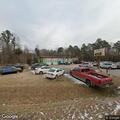 Car hits deer and leaks fluid in parking lot
