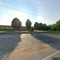Truck with camper hits school, car, and shed then leaves