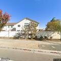 Police monitor activity at house and orchard