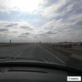 Unsafe silver minivan entering southbound turnpike