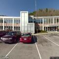 Driver blocked in by cars in parking lot