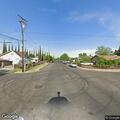 Two-car crash with vehicle on side on Spruce Street