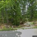 Driver trapped in car by fallen trees on roadway
