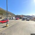 Reckless pickup hits sign and car near Lee Avenue