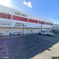 Person receiving medical aid at industrial location