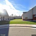 Person experiencing abdominal pain at church