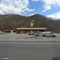 Minor vehicle bump at gas station parking area