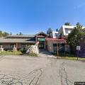 Female adult unconscious but breathing at hospital parking lot
