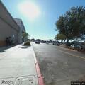 Smoldering fire behind mall store by freeway