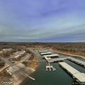 Unoccupied pontoon boat left running by marina