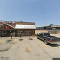 Officer checks suspicious vehicle at gas station