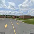 Officer checks school after perimeter alarm