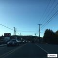 Two-vehicle crash with fluid leak near Daniels stores