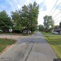 Branches lodged in utility pole causing power issues