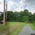 Person kicks door at home in Crab Orchard