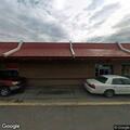 Suspicious man walking around fast food restaurant