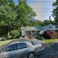 Officer checks trash bag at North Avenue home