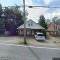 Man punching ground on sidewalk in Beckley