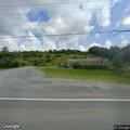 Suspicious man tampering with gas cans on property