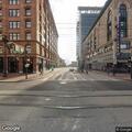 Man swinging metal pipe near pedestrians on Market