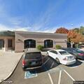 Female slumped in parked Tesla at community center