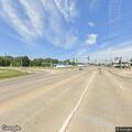 Driver slumped over steering wheel on highway shoulder