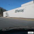 Person slumped in gray SUV at Crossroads Mall parking lot